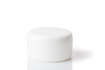 Cosmetic cream in a white jar. On a white isolated background.