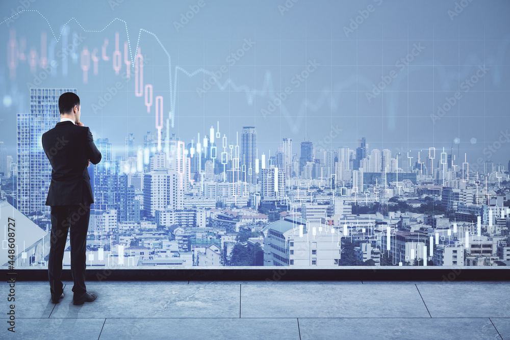 Aufkleber back view of thoughtful young businessman looking at city view with forex chart and mock up place. t