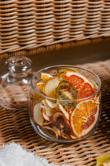 Organic dried fruits. Homemade dehydrated fruit chips in a glass form. The concept of healthy eating. dried apples, orange, grapefruit, kiwi, banana top view.