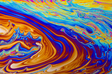 Rainbow colors. Psychedelic multi colored patterns background. Photo macro shot of soap bubbles