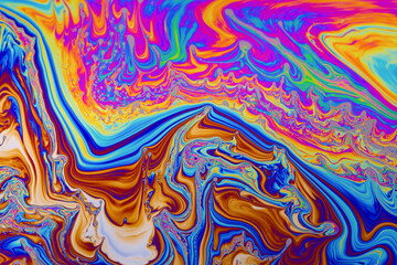 Rainbow colors. Psychedelic multi colored patterns background. Photo macro shot of soap bubbles