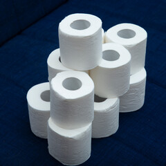Toilet paper on a dark blue background. Personal hygiene items.