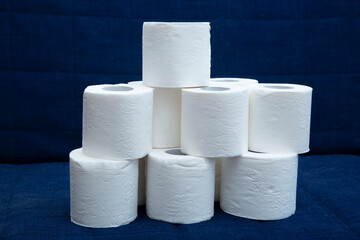 Toilet paper on a dark blue background. Personal hygiene items.