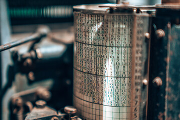 Old typography printing machine with letter samples. Mechanical printing process.