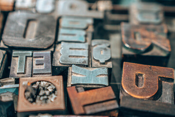 Old typography printing machine with letter samples. Mechanical printing process.