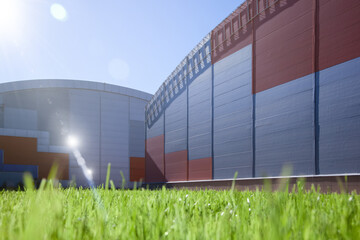 Obraz premium Bright green clipped grass in sunbeams background. Fresh lawn.