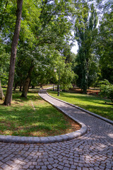 Beautiful sunny summer day in a green park in Craiova, Romania