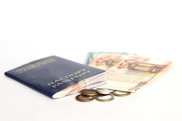 Identity documents and money with coins on a white background