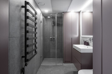Modern minimalist bathroom interior design with grey stone tiles