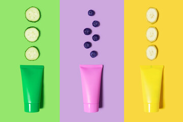 Creative beauty fashion concept photo of cosmetic recyclable bottle lotion cream with blueberry banana and cucumber.