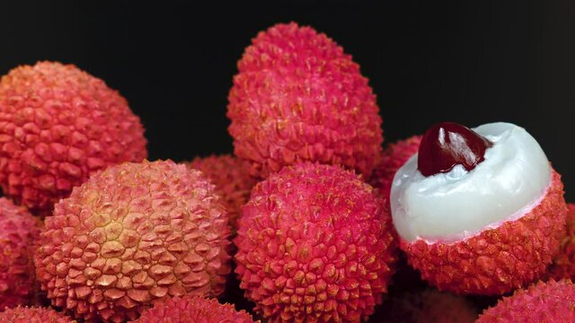 Heap of fresh lychee over black