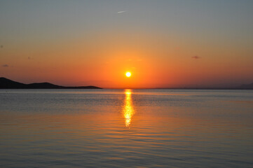 Sunset over the water Mar Menor in La Manga, Murcia with view for Isla del Barón