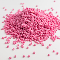 Pink granules of polypropylene or polyamide on a white background. Plastics and polymers industry. Copy space.