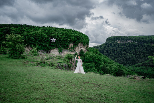 wedding photo shoot in the mountains. the bride stands in the mountains.
