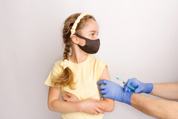 A nurse is giving vaccinations to patients with a syringe. White background. Close-up shot of...