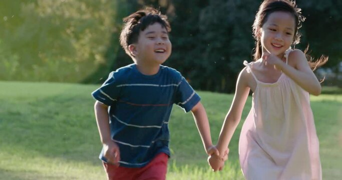 Happy children playing on meadow,4K