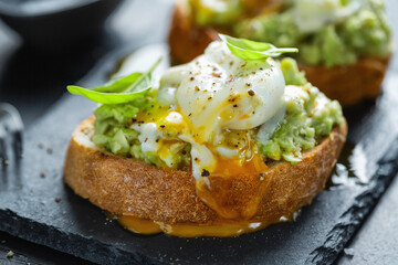 Tasty fresh toast with avocado and egg