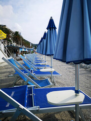 deck chairs and umbrellas on the sandy beaches of the Ligurian Riviera of Spotorno