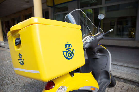 Santiago de Compostela, Spain. August 2, 2021: Correos bike. Spanish post office delivery motorcycle