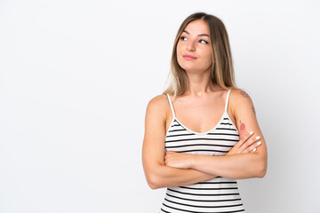Fototapeta premium Young Romanian woman isolated on white background looking to the side