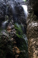 Bavaria Hölltalklamm, waterfalls and cascades into alpine river in deep gorge