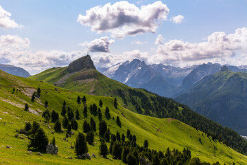 Beautiful green hills with a radio antenna on the top of the hill in the background