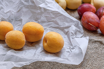 still life of apricots, plums and nectarines close up