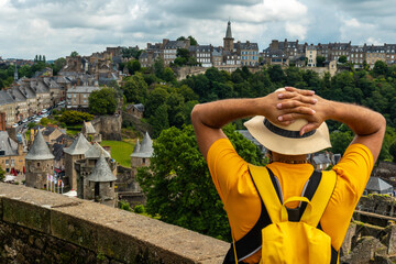 A young tourist girl visiting Fougeres castle in the covid-19 pandemic. Brittany region, Ille et...
