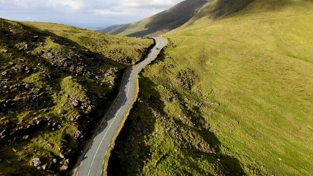 A road going through a mountain pass. cornor pass Dingle Kerry Ireland
