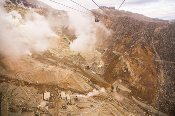 Hakone Ropeway with cable car across Owakudani Valley and active volcano. Located in Fuji Hakone...