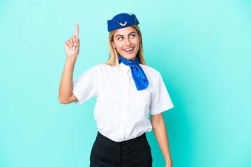 Airplane stewardess Uruguayan woman isolated on blue background intending to realizes the solution while lifting a finger up