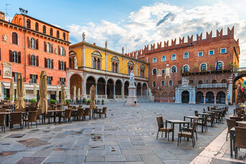 Verona old town square Piazza dei Signori with Dante statue and street cafe with nobody. Veneto, Italy