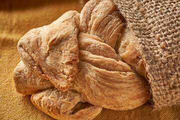 braided homemade bread on tablecloth