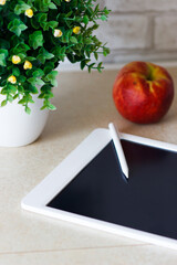 White tablet for drawing on the table, soft focus background