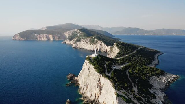 Aerial view of Cape of Ducato, famous lighthouse of Greek island Lefkada, tracking shot, 4K.