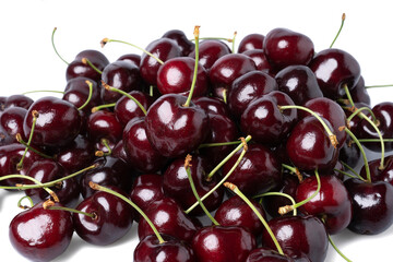 Pile of  Fresh dark red cherries of the type Kordia isolated on a white background