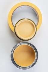 Opened paint can and painters tape top view