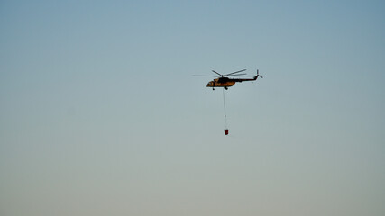 ANTALYA-MANAVGAT-SIDE, TURKEY - AUGUST 02, 2021: The forest fire that started in Manavgat threatens settlements and tourism facilities.  Yellow smoke covered the place of the blue sky and sea.