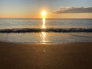 Fototapeta na wymiar Dawn at sea, sand beach, Rhodes Greece 