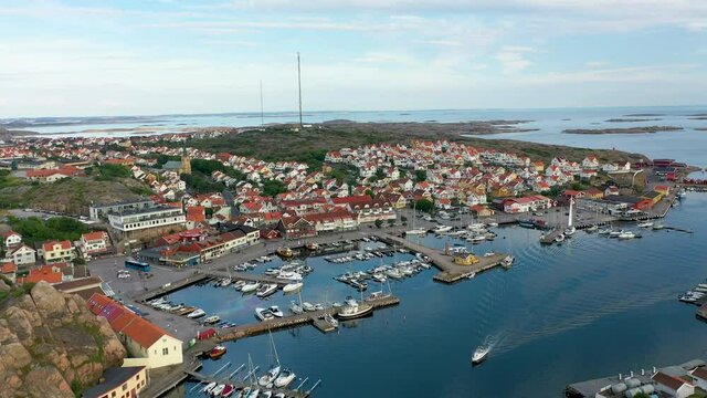 Beautiful coastal village of Kungshamn on the west coast of Sweden, aerial view from above over the town and marina