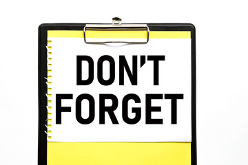 Don't Forget, text on white paper, on a yellow backing and colored on a white background