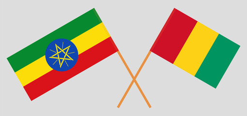 Crossed flags of Ethiopia and Guinea. Official colors. Correct proportion