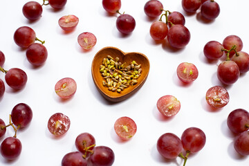 Fresh grape with seeds on white background.