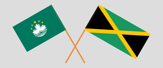 Crossed flags of Macau and Jamaica. Official colors. Correct proportion