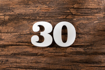 thirty 30 - White wooden number on rustic background