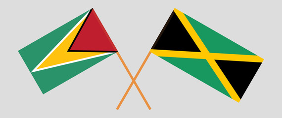 Crossed flags of Guyana and Jamaica. Official colors. Correct proportion