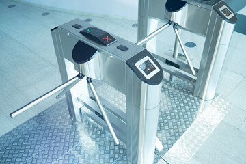Turnstiles inside business center. Access restriction turnstiles. Concept - access to premises by...