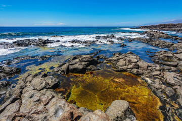 stonesl beach under blue sky