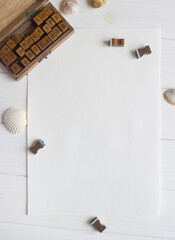 Mockup for A4 paper with letters stramps , markers and shells