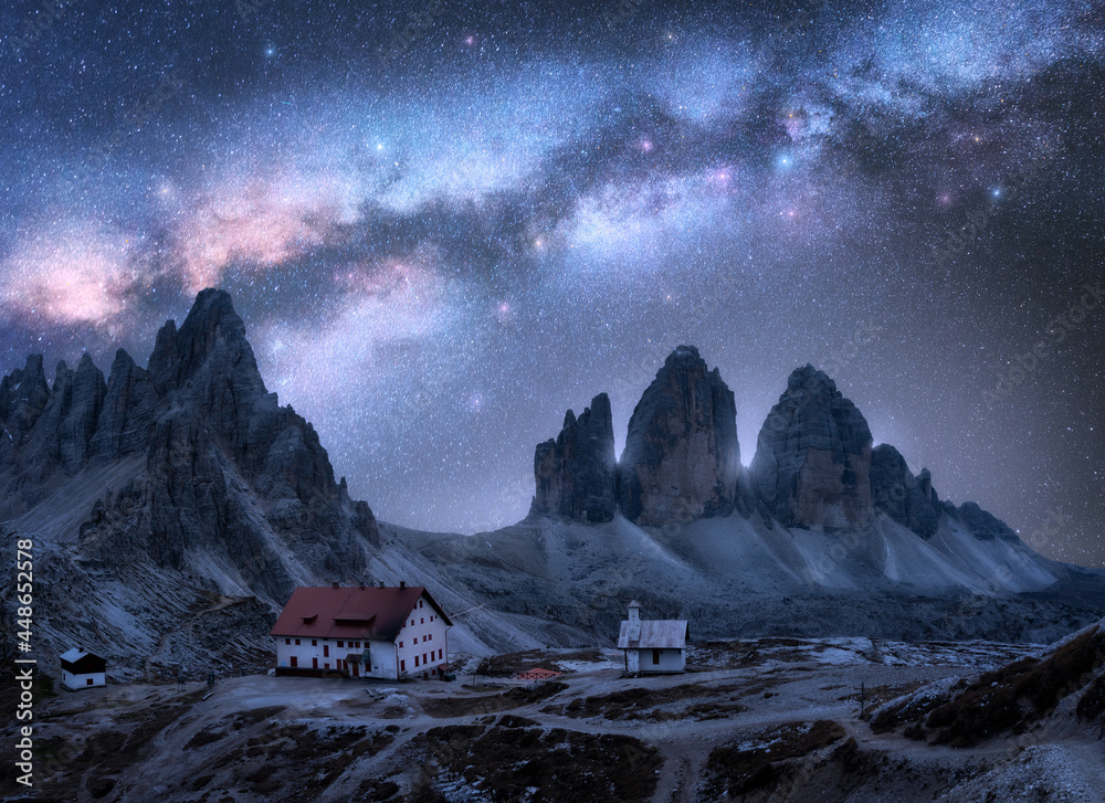 Wall mural milky way over the mountains at starry night in summer. landscape with alpine mountains, building, c